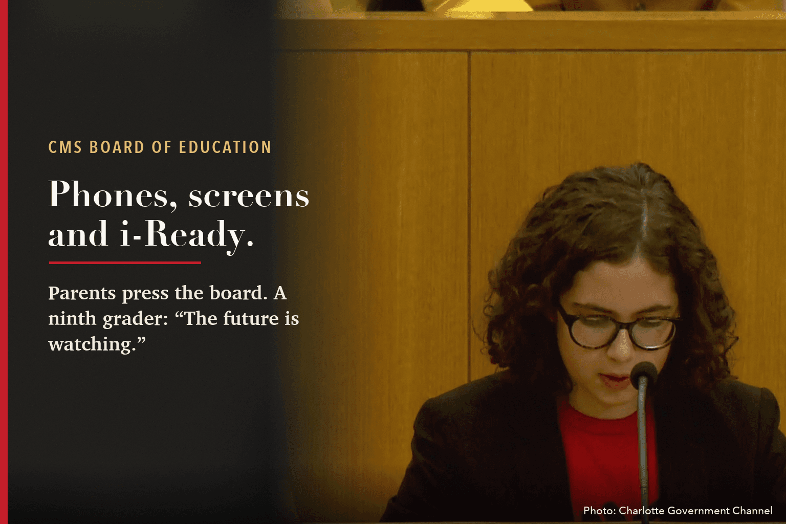 Celia Kaul, a ninth grader, speaks at the CMS board podium, beside the words: Phones, screens and i-Ready. Parents press the board. A ninth grader: The future is watching.