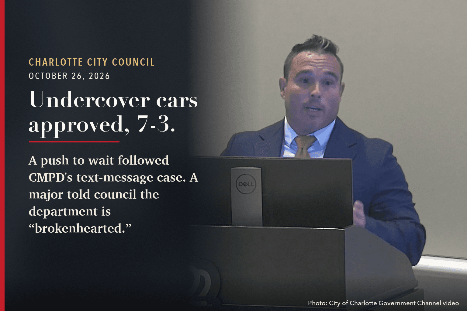 CMPD Maj. Stephen Fischbach speaks at the lectern before Charlotte City Council, beside the words: Undercover cars approved, 7-3.