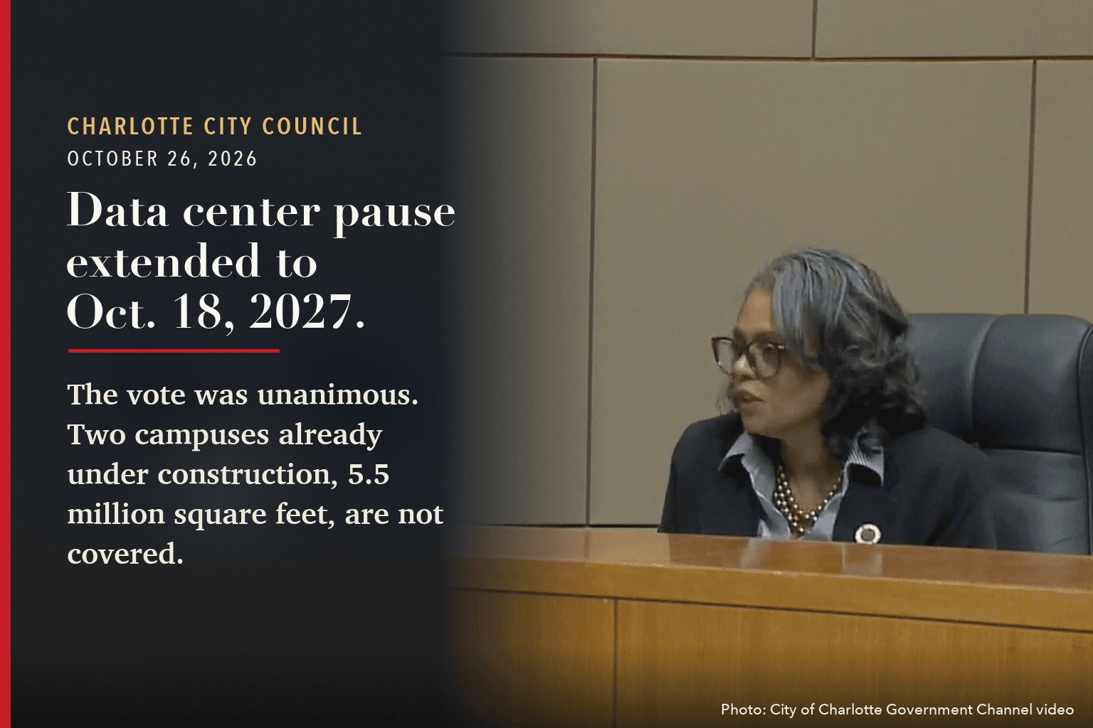 A Charlotte City Council member at the dais, beside the words: Data center pause extended to Oct. 18, 2027.